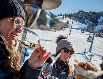 A couple at Apres Ski outside in Aspen