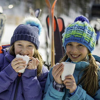 kids drinking hot cocoa in aspen