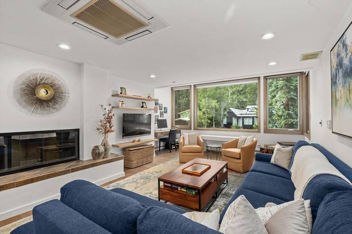 The living room of the rental chateau snow unit 301.