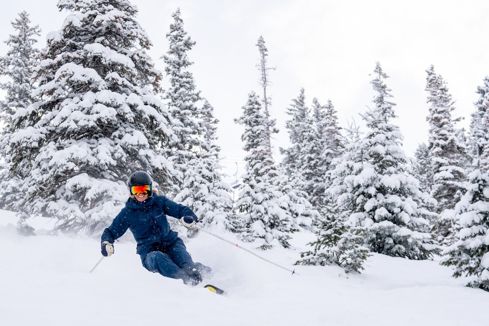 A person skiing down the slopes in Aspen.